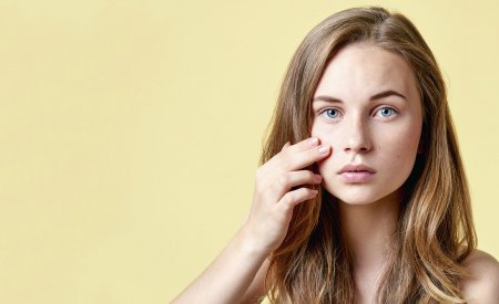 Woman checking her skin
